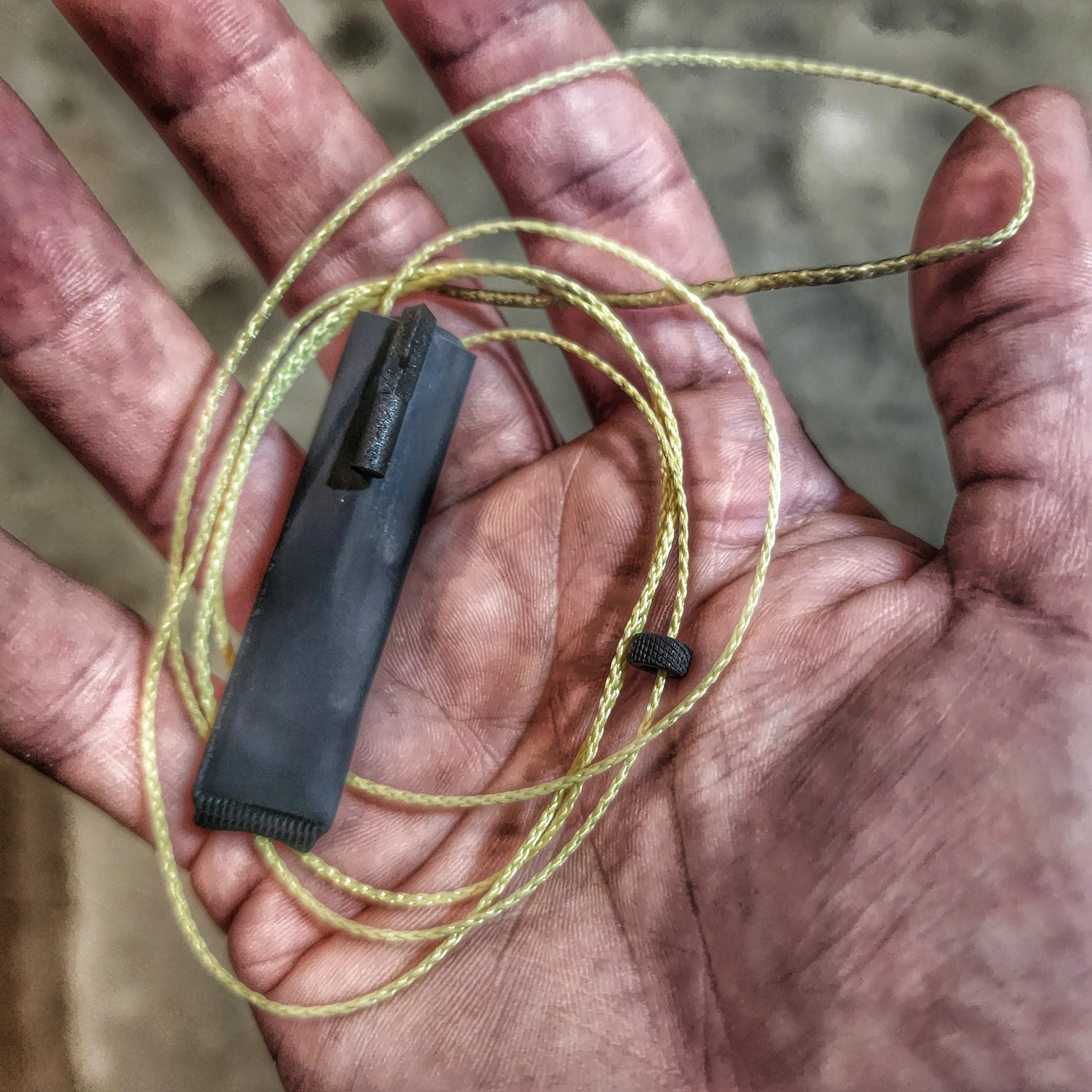 SERE Lanyard: Escape Implements and EDC Tools secured around a kevlar friction saw necklace.